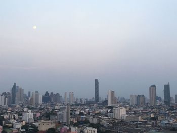 Buildings in city against sky