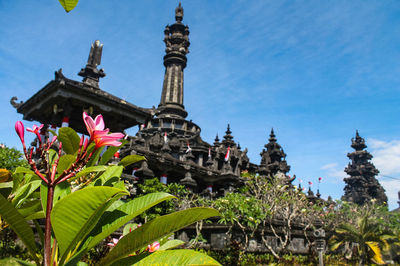 View of flowering plants outside temple