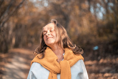 Portrait of a smiling young woman in winter