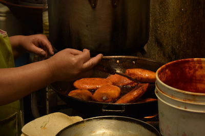 Close-up of man preparing food in kitchen