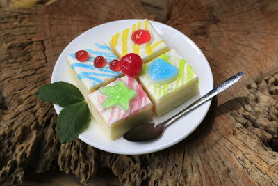 Fancy cake on old wooden floor.