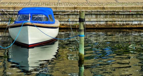 Boat moored in water