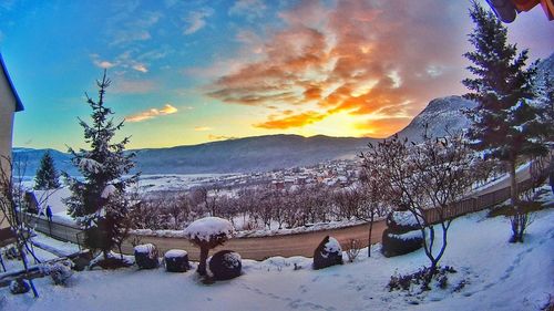 Scenic view of dramatic sky during winter