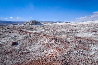 Scenic view of land against sky