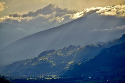 Scenic view of mountains against dramatic sky