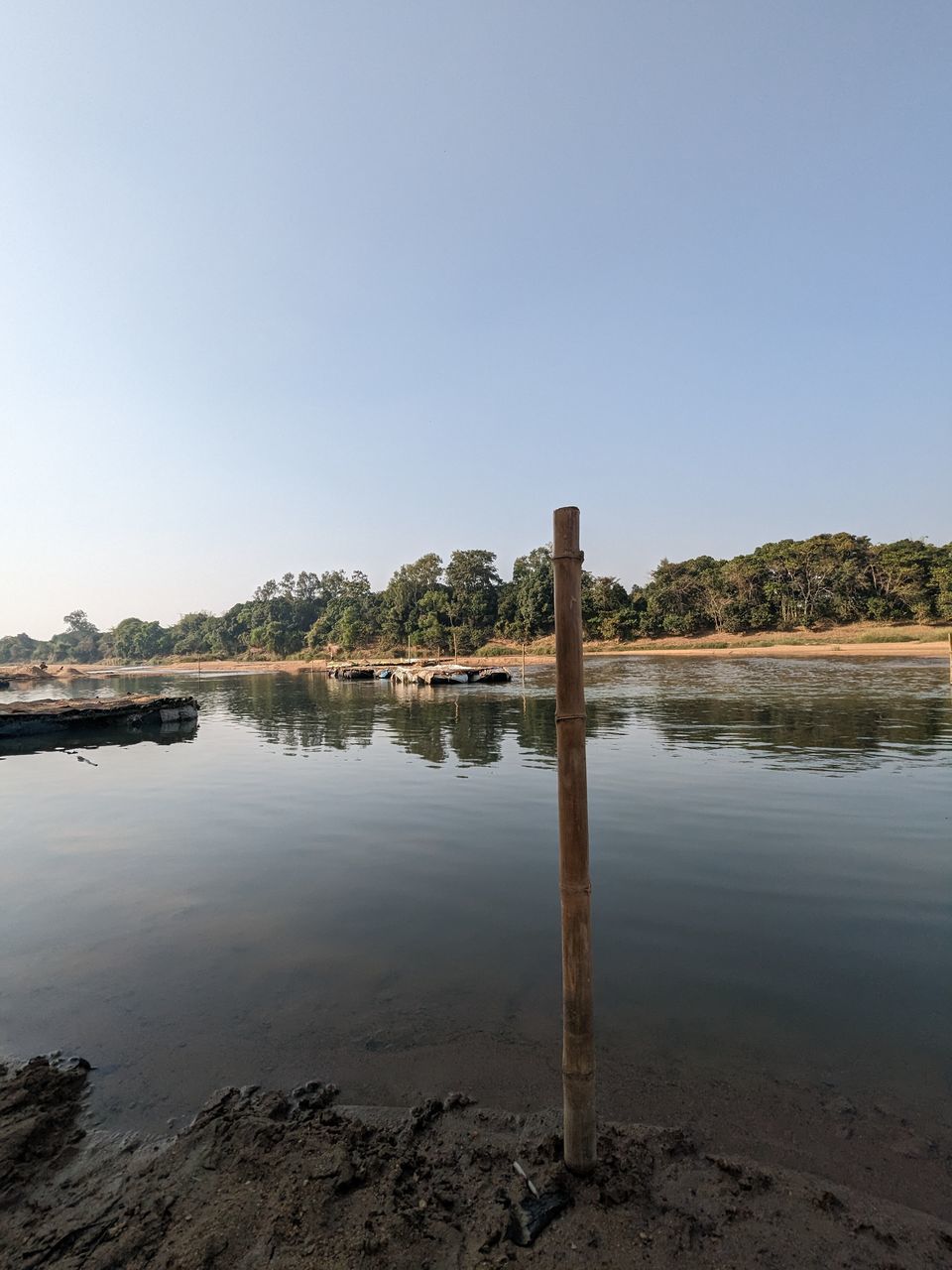water, sky, shore, reflection, sea, nature, body of water, land, clear sky, environment, coast, landscape, tranquility, scenics - nature, beach, horizon, architecture, no people, beauty in nature, travel destinations, tranquil scene, reservoir, outdoors, copy space, travel, morning, day, built structure, blue, bay, sunny, dusk, tourism, city, ocean