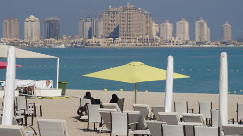 People relaxing on beach