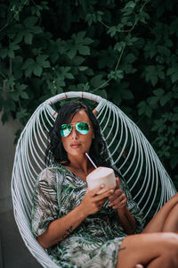 Portrait of young woman wearing sunglasses