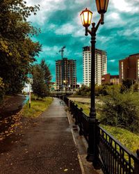 Street amidst buildings against sky