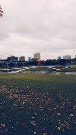 Buildings against cloudy sky