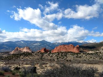 Scenic view of mountain against cloudy sky