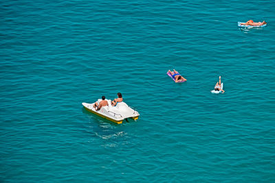 High angle view of birds in sea