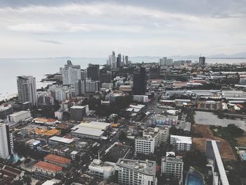 Aerial view of cityscape against sky