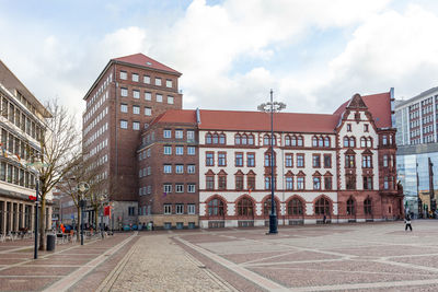 Buildings in city against sky