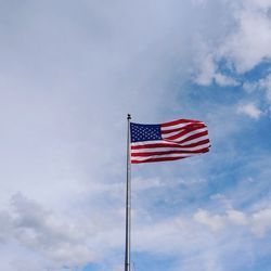 Low angle view of flag against sky