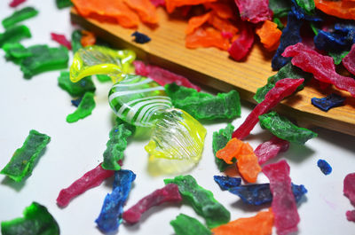 High angle view of multi colored candies on table