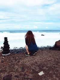 Rear view of woman on beach