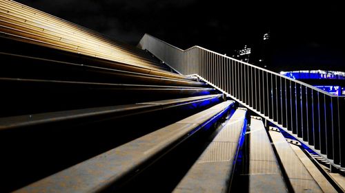 Illuminated tunnel at night