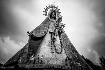 Low angle view of regina rica against sky