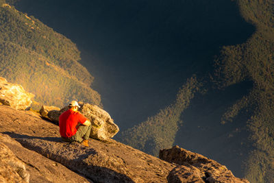 Rear view of man standing on a rock in yosemite national park