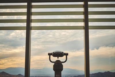 Viewing scope against sky during sunset