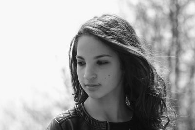 Close-up of thoughtful beautiful woman looking away