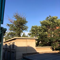 Low angle view of built structure against clear blue sky