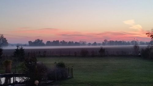 Scenic view of landscape at sunset