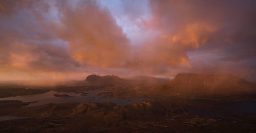 Smoke emitting from volcanic mountain against sky