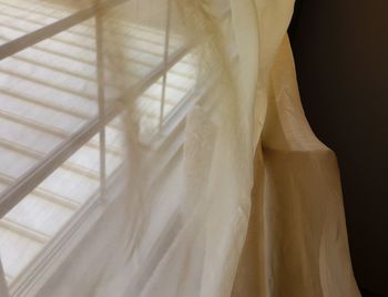 Close-up of curtain against window