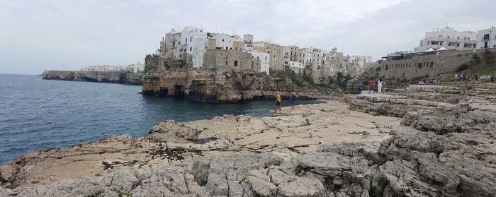 Panoramic view of beach against sky in city