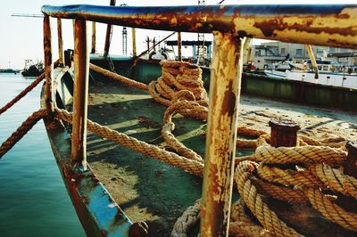 View of fishing boats moored at harbor