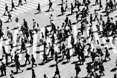 High angle view of people walking on city street