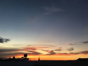 Scenic view of silhouette landscape against romantic sky at sunset