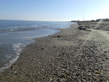 Scenic view of beach against clear sky