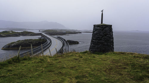 View of the curvaceous atlantic ocean road in norway on a foggy day.