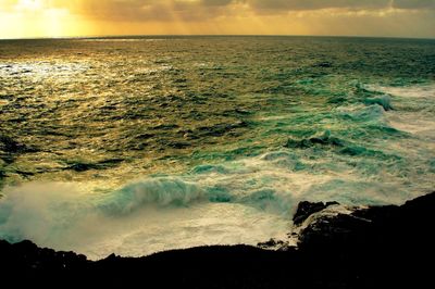 Scenic view of sea against sky during sunset