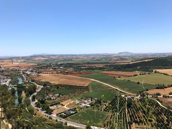 High angle view of agricultural field against clear sky