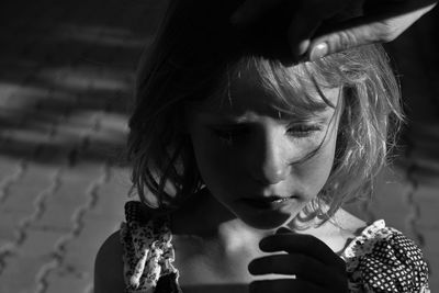 Close-up of girl holding smart phone outdoors