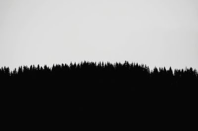 Silhouette of landscape against clear sky