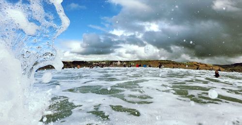 Scenic view of sea against sky during winter