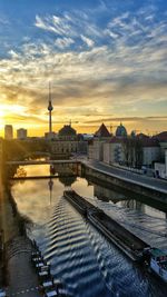 High angle view of barge sailing in spree river at sunset