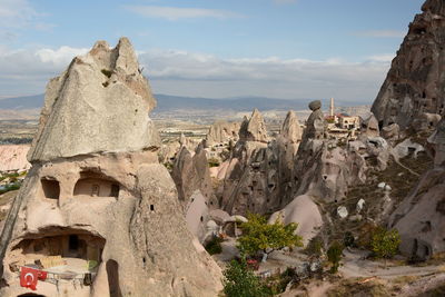 Panoramic view of buildings and mountain against sky