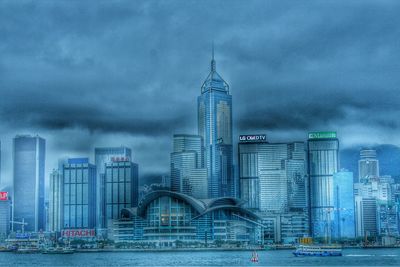 City skyline against cloudy sky