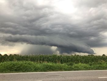 Scenic view of landscape against cloudy sky