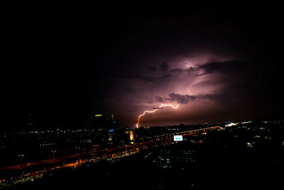 High angle view of city against cloudy sky