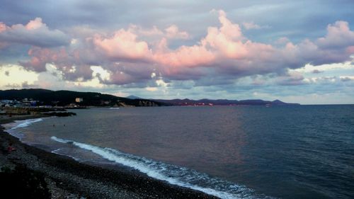 Scenic view of sea against cloudy sky