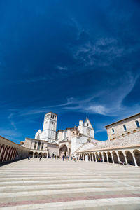 Low angle view of historical building against blue sky