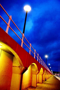 Low angle view of illuminated street light against sky at night