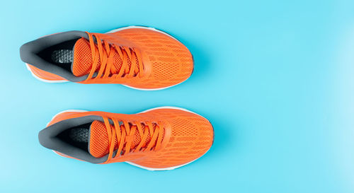 High angle view of shoes against blue background